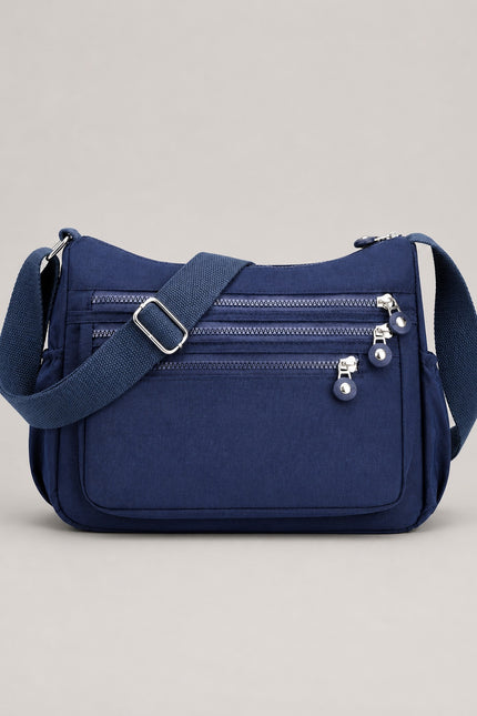 Sac bandoulière femme en tissu Oxford multi-poches — vue de face sur fond gris clair