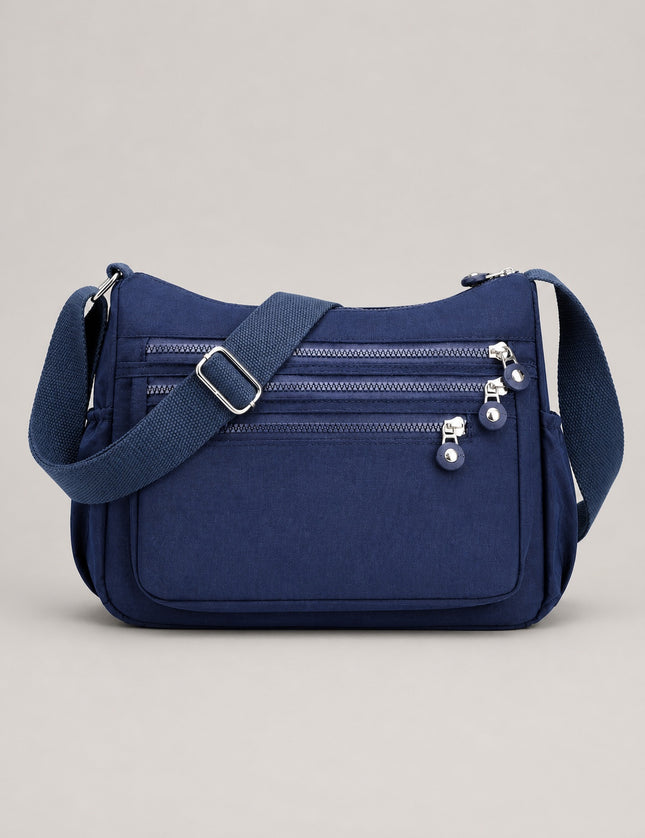 Sac bandoulière femme en tissu Oxford multi-poches — vue de face sur fond gris clair