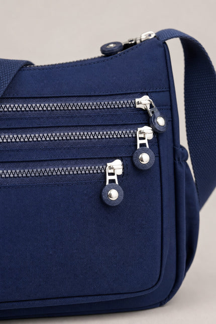Sac bandoulière femme en tissu Oxford multi-poches — détail rapproché du sac