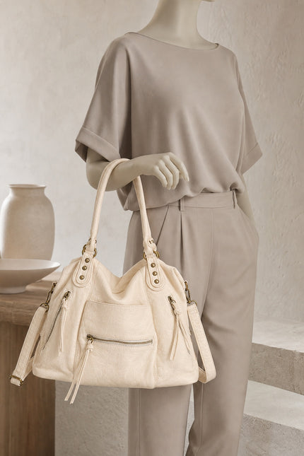 Sac cabas de cours femme zippé avec bandoulière — porté à la main en vue rapprochée