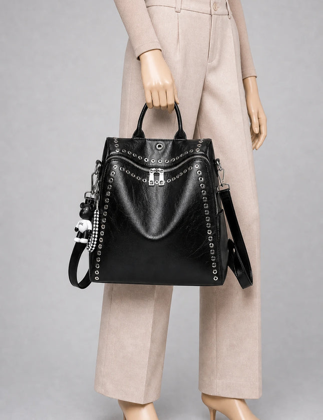 Sac cuir compact femme élégant quotidien porté à la main en studio - Aurean Paris - source inputs